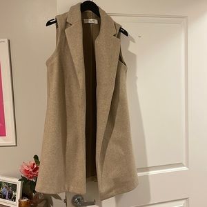 Tan sleeveless vest size small